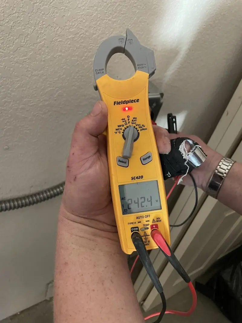 Voltage testing with clamp meter during Electrical Installation Services in Merriam